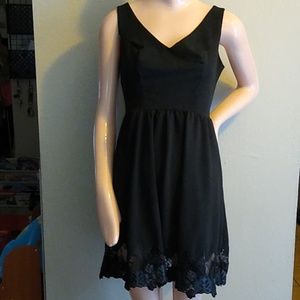 Black Sleeveless Dress with a Lacy Flare